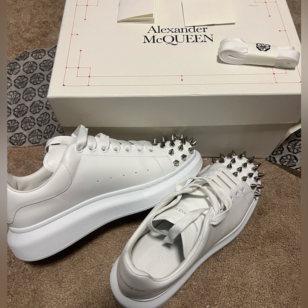 White and silver size 42 men’s Alexander McQueen sneakers.